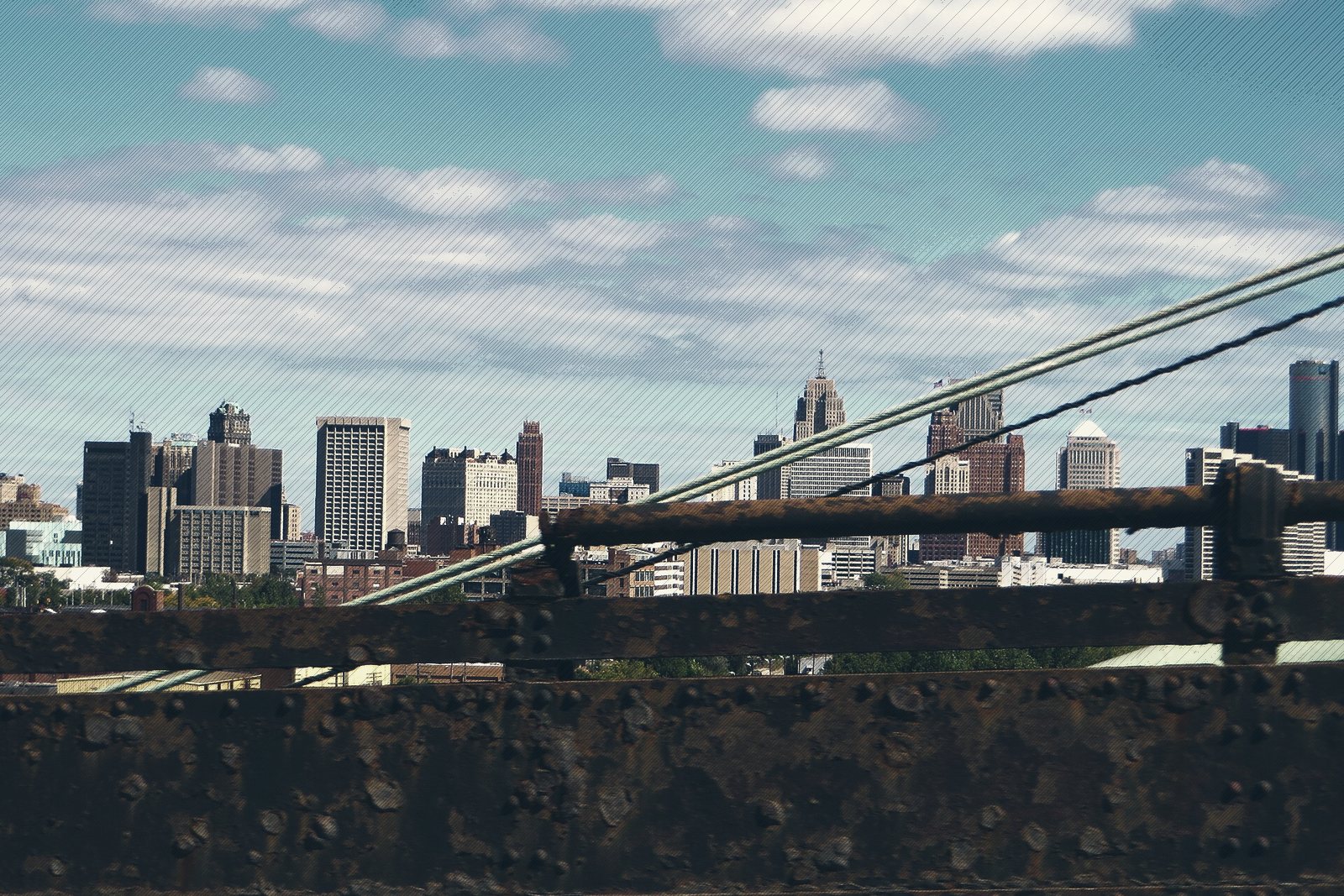 Detroit's skyline seen through the steelwork of the Ambassador Bridge