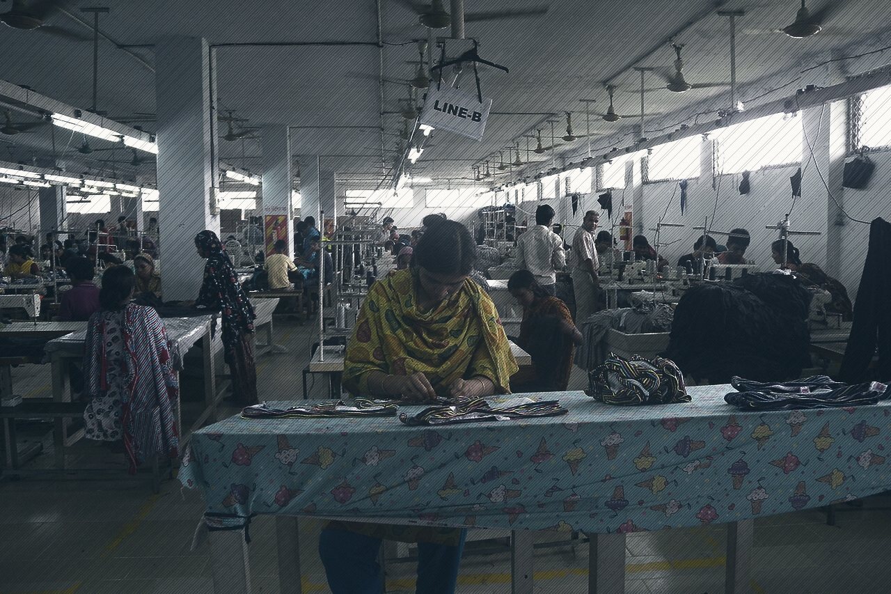 Women working at cutting tables in a garment factory in Bangladesh