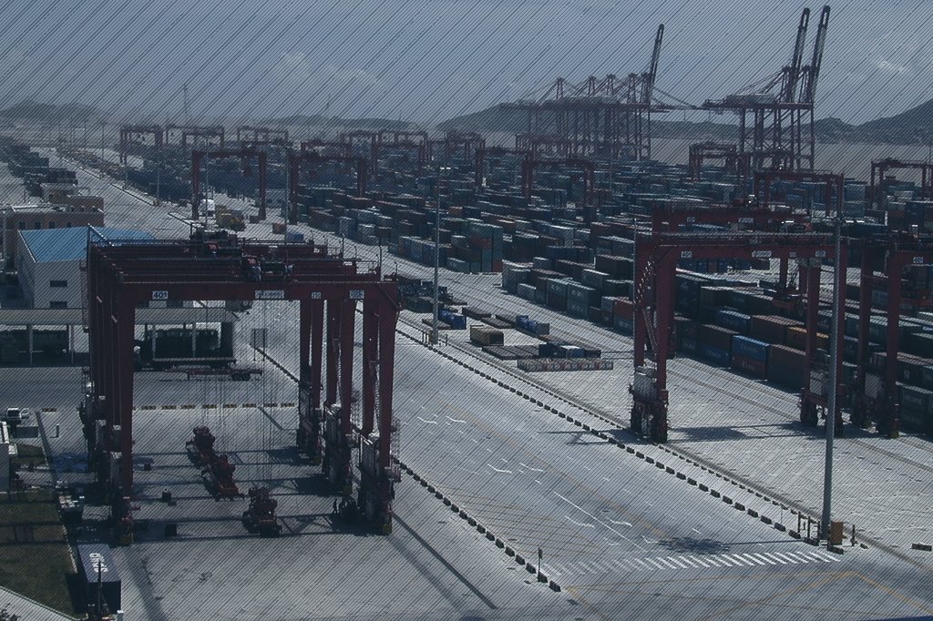 Cranes and container stacks at Yangshan Deep-water Port, Shanghai